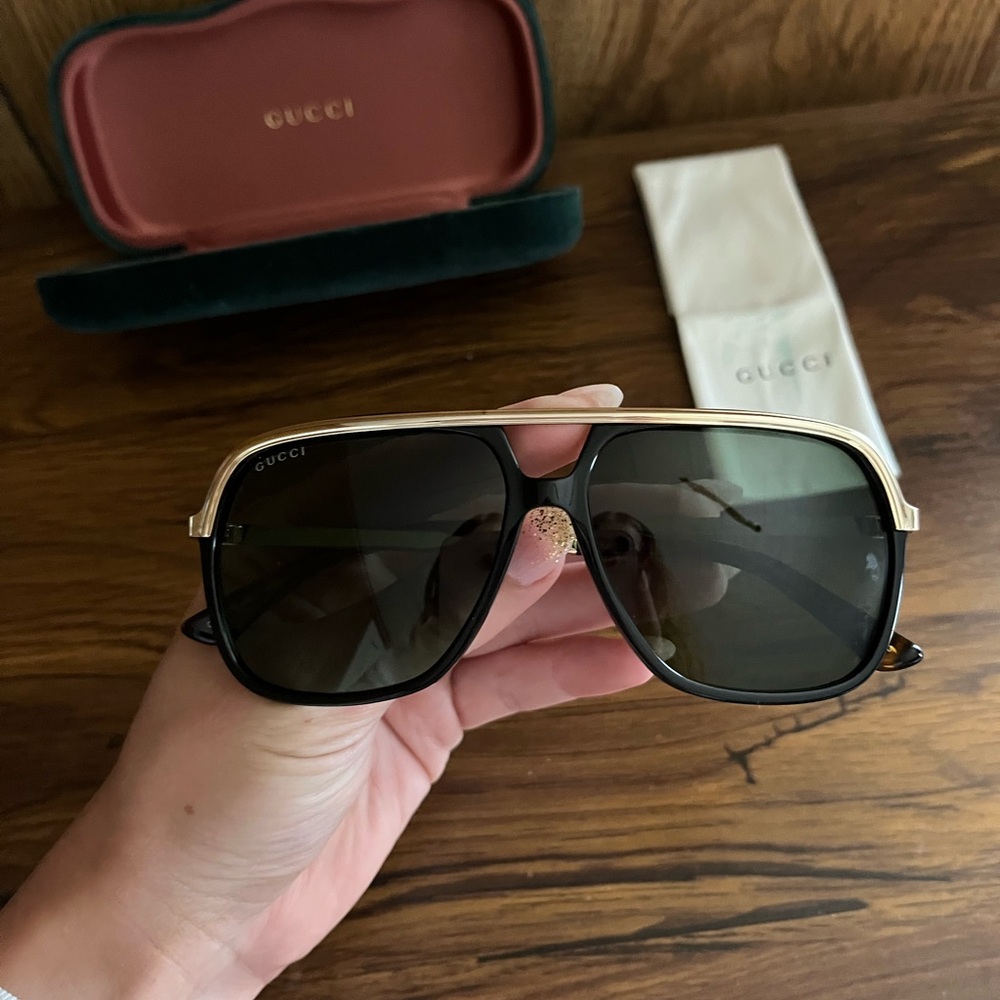 Gucci Black Frame Sunglasses with Gold Trim